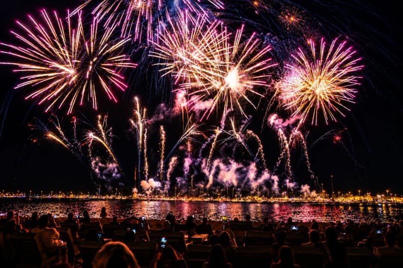 Fireworks over Cannes Bay viewed from a beachfront club at night