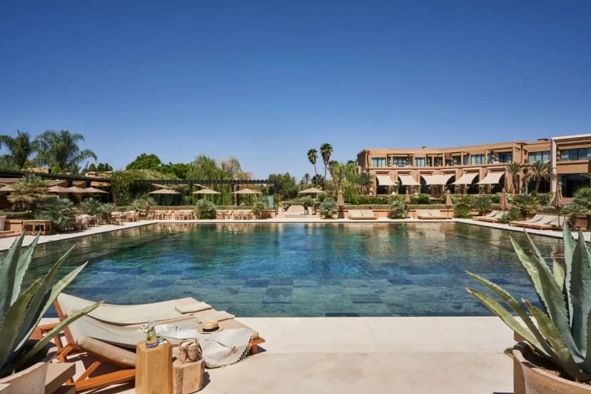 Pool day pass in Marrakech with resort sunbeds, gardens and blue sky