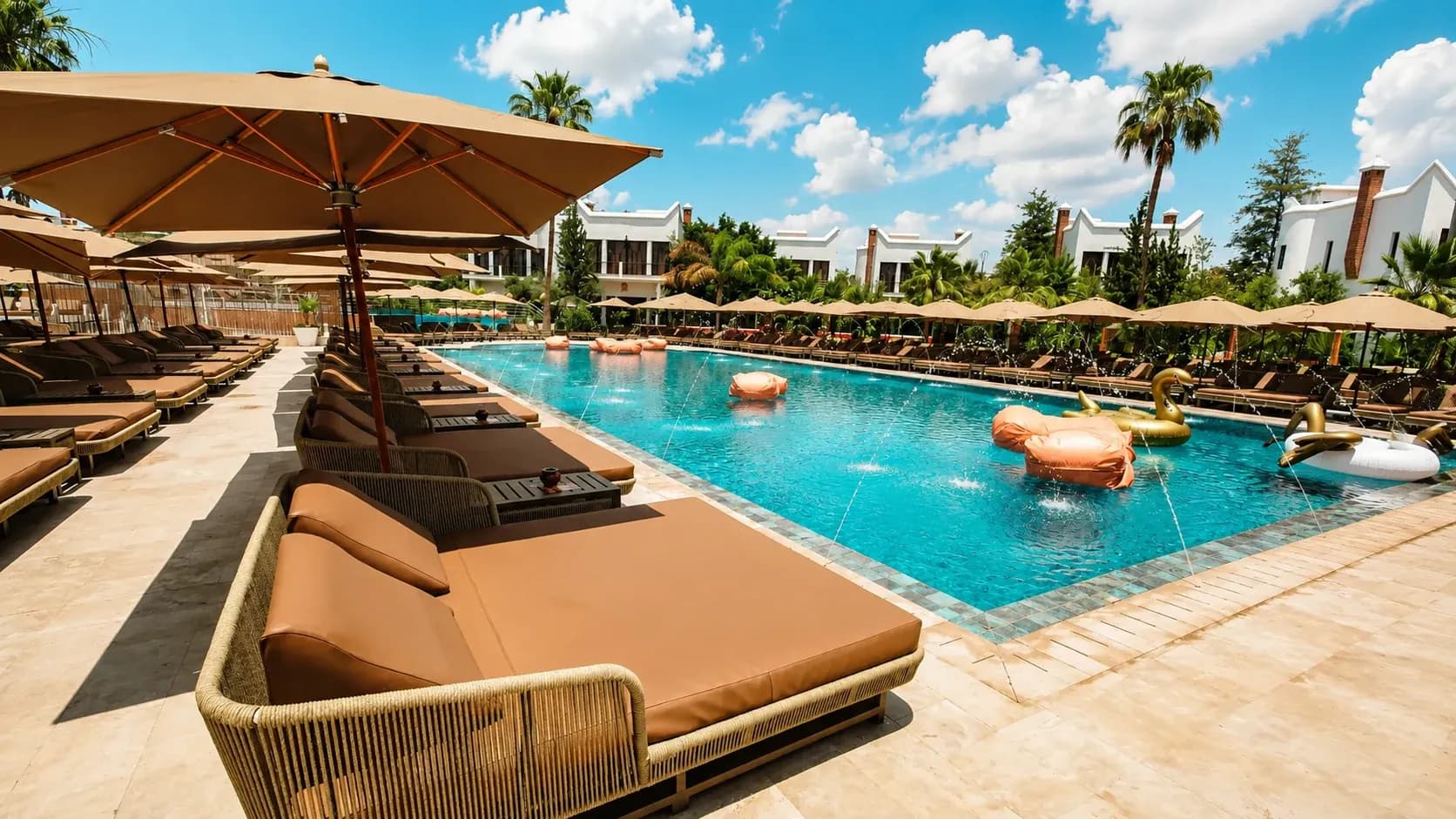 Famous Beach Marrakech pool with sunbeds, parasols and a pool club atmosphere